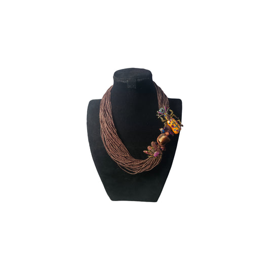 Detailed view of layered brown seed bead strands showing woven texture and depth
