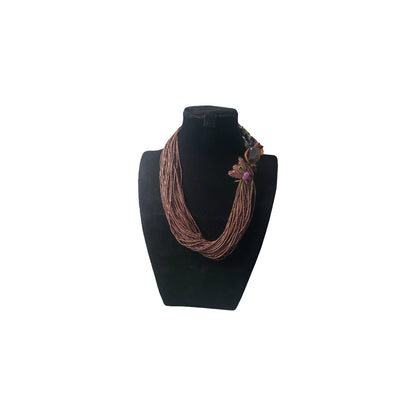 Handcrafted brown seed bead mutli strand statement necklace with insect inspired focal elements from the Opus collection