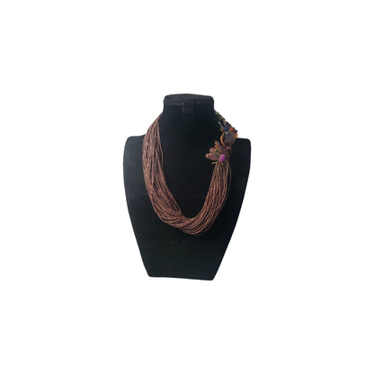 Brown Multistrand Statement Necklace on a black mannequin bust against a white background
